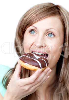 Caucasian woman eating a cake