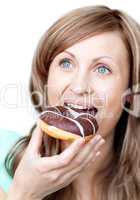 Caucasian woman eating a cake