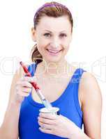 Attractive woman using a paintbrush