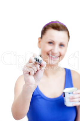 Joyful woman using a paintbrush