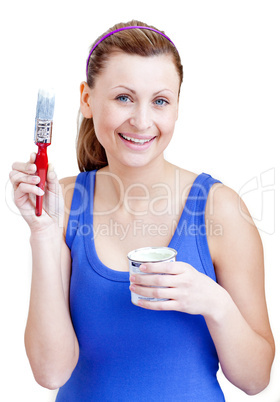Bright woman using a paintbrush