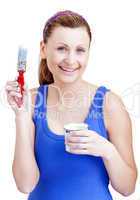 Bright woman using a paintbrush
