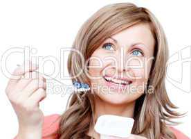 Joyful woman eating a yogurt