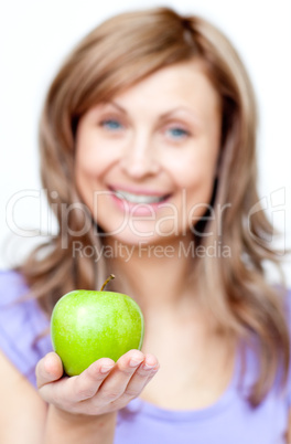 Smiling woman holding an apple