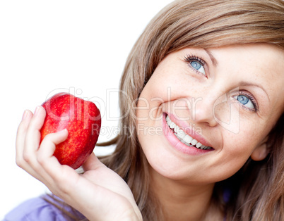 Radiant woman holding an apple