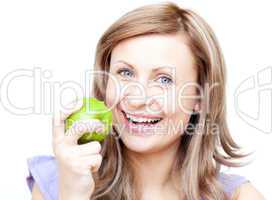 Delighted woman holding an apple