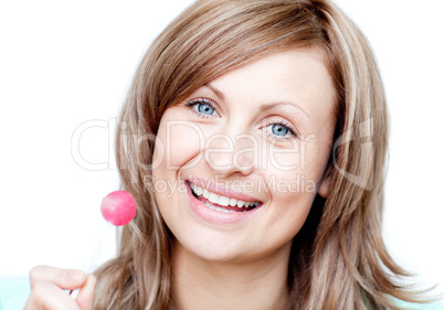 Smiling woman holding a lollipop
