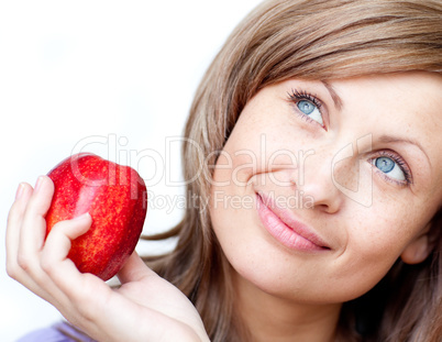Bright woman holding an apple