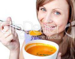 Hungry woman holding a soup bowl