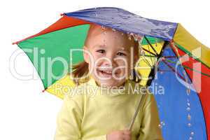 Cute child catching raindrops under umbrella