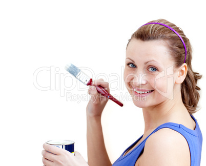 Confident woman using a paintbrush