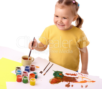 Cute child play with paints