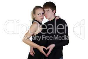 Boy and girl posing on a white background