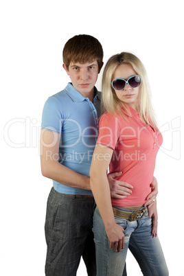Girl and boy posing on a white background