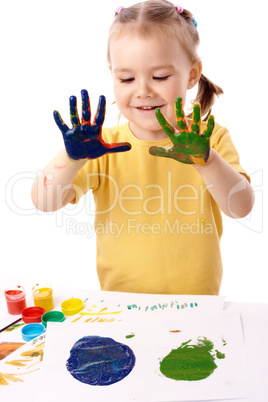 Cute child paint using hands