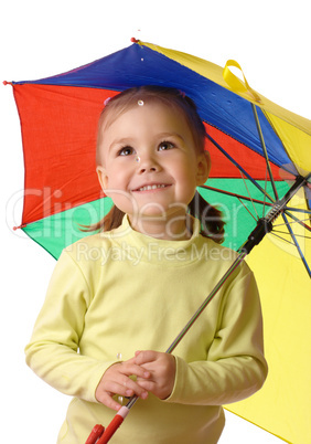 Cute child catching raindrops under umbrella