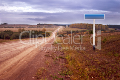 Dirt road and road sign