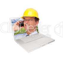 Laptop and Man with Hard Hat on Cell Phone