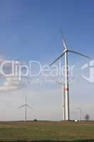 wind turbines under blue sky