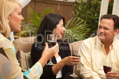 Three Friends Enjoying Wine on the Patio