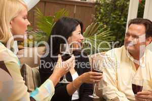 Three Friends Enjoying Wine on the Patio