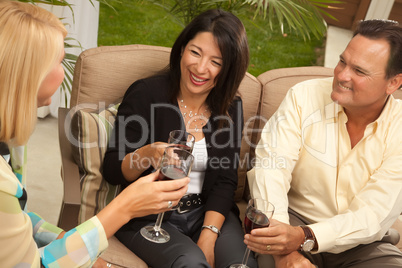 Three Friends Enjoying Wine on the Patio