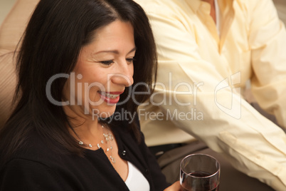 Attractive Hispanic Woman Enjoying Wine