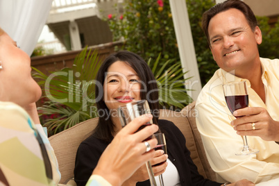 Three Friends Enjoying Wine on the Patio