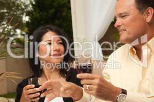 Hispanic Woman and Caucasian Man Enjoying Wine