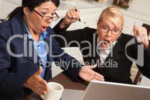 Businesswomen Celebrate Success on the Laptop