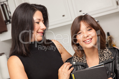 Attractive Hispanic Proud Mom with Her Pretty Schoolgirl Daughte