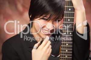 Multiethnic Girl Poses with Electric Guitar