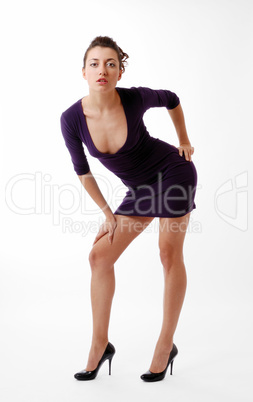 Woman leaning over in skinny dress with decollete