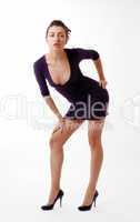 Woman leaning over in skinny dress with decollete