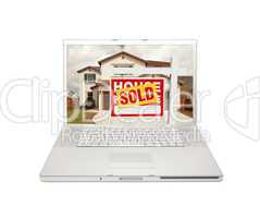 Sold For Sale Real Estate Sign on Laptop