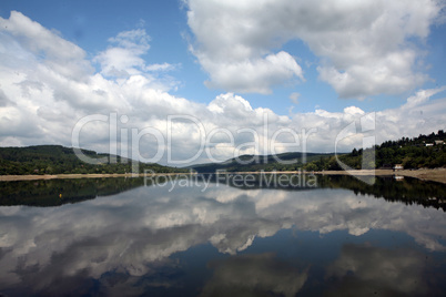 Landscape with ake with cloudy sky