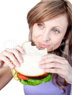 Cheerful woman eating a sandwich