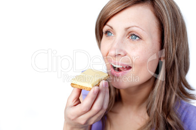 Attractive woman eating a cracker with cheese