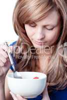 Beautiful woman eating cereals