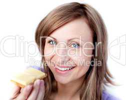 Beautiful woman eating a cracker with cheese