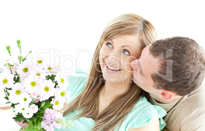 Caring man giving a bouquet to his girlfriend