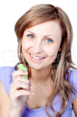 Beautiful woman eating celery