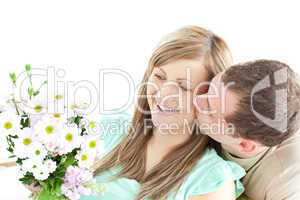 Enamored man giving a bouquet to his girlfriend