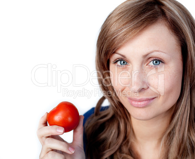 Attractive woman holding a tomato