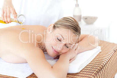 Relaxed woman receiving a back massage