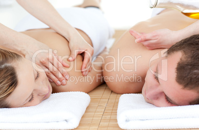 Relaxed couple receiving a back massage