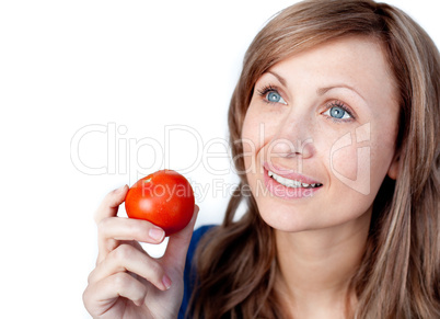 Positive woman holding a tomato