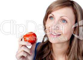 Positive woman holding a tomato