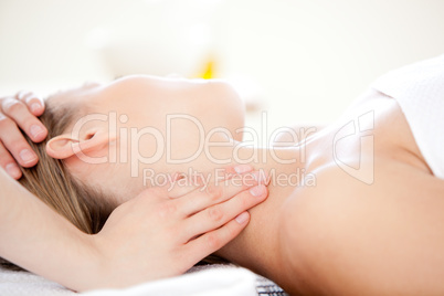 Close-up of a caucasian woman receiving a head massage