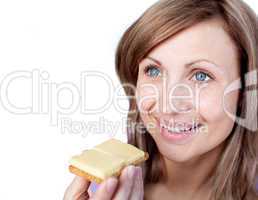 Cheerful woman eating a cracker with cheese